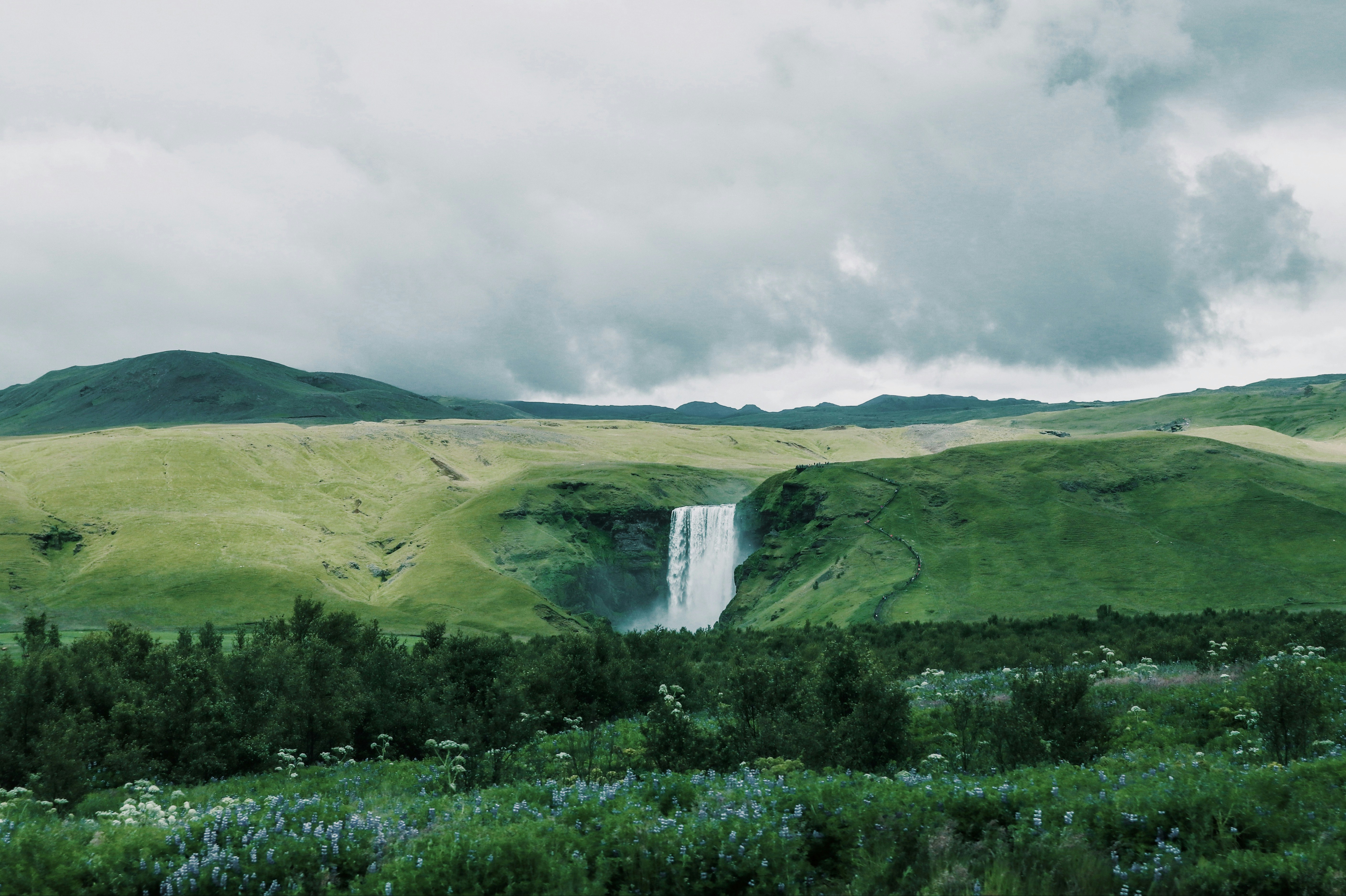 wide-angle photography of waterfalls during daytime