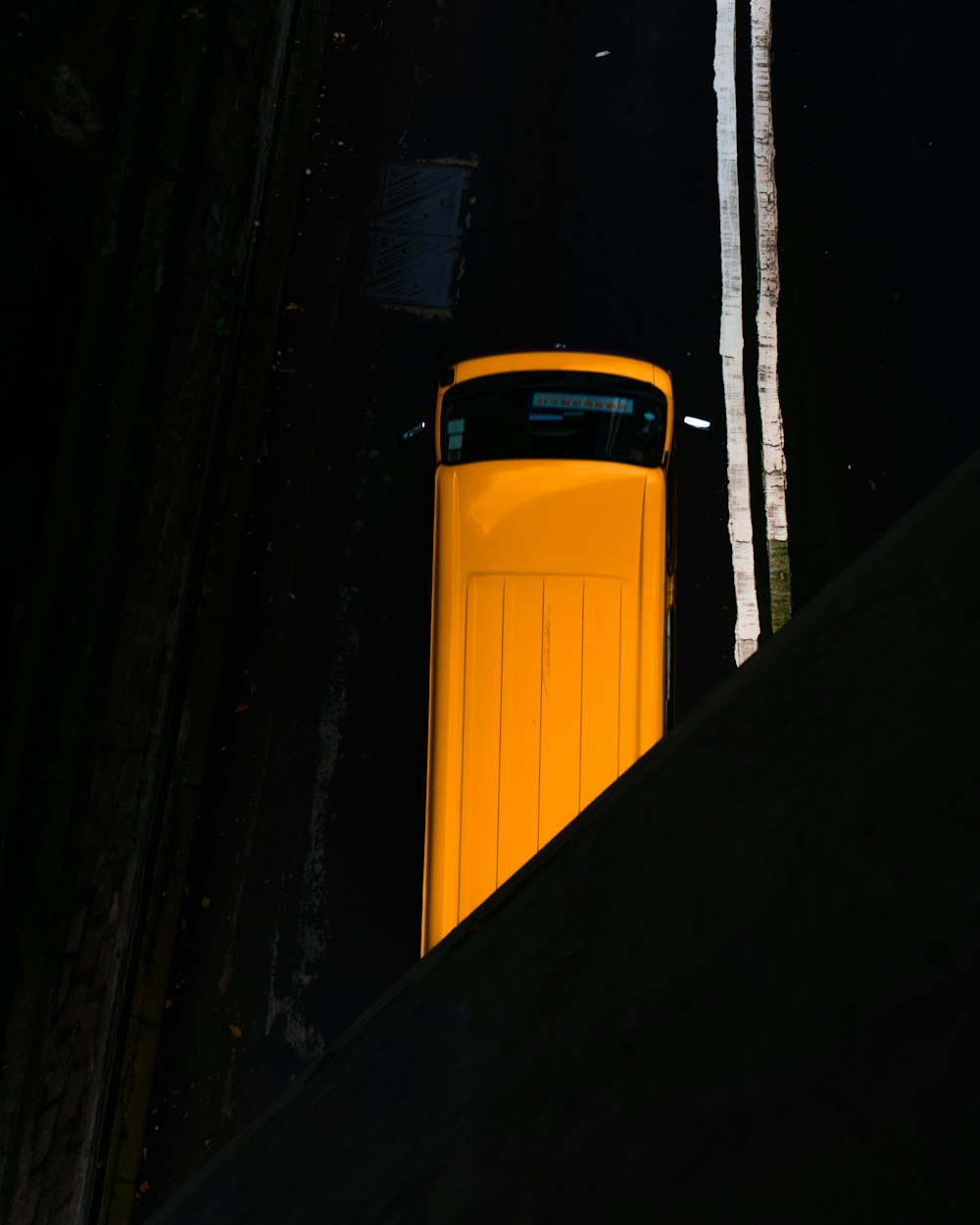 blue vehicle on road