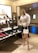 A happy customer wearing a stylish outfit while shopping online.