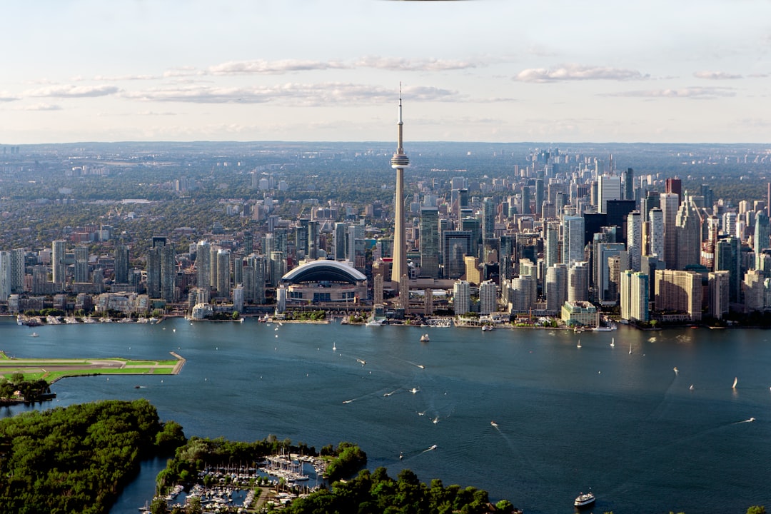 gray buildings near body of water in aerial photo