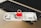 An Indian 500 rupee note is placed on a laptop keyboard with a red padlock sitting on top of the note.