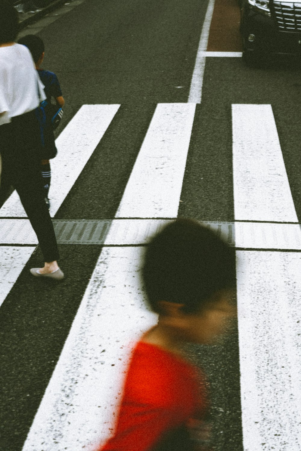 person crossing street during daytime
