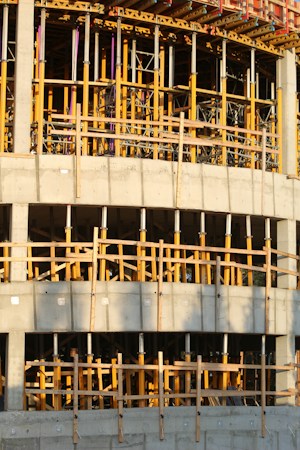 An unfinished concrete building under construction, similar to the school replacement and renovation projects CCSD funds with building bonds
