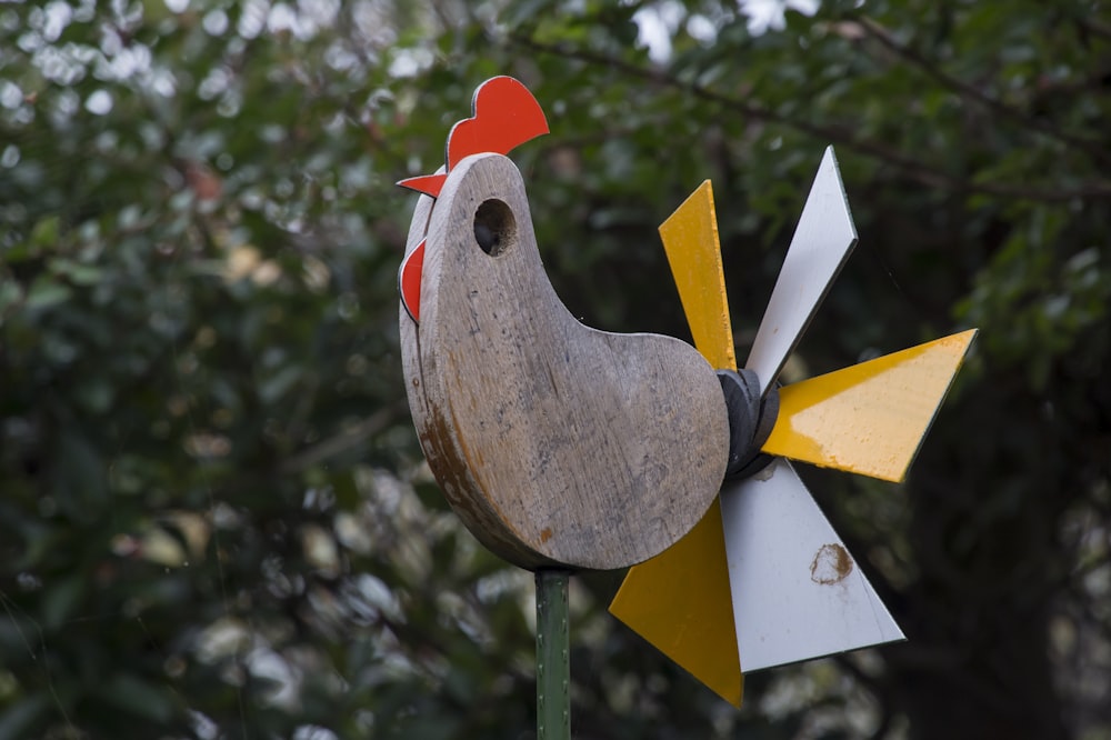 brown and orange chicken weather vane