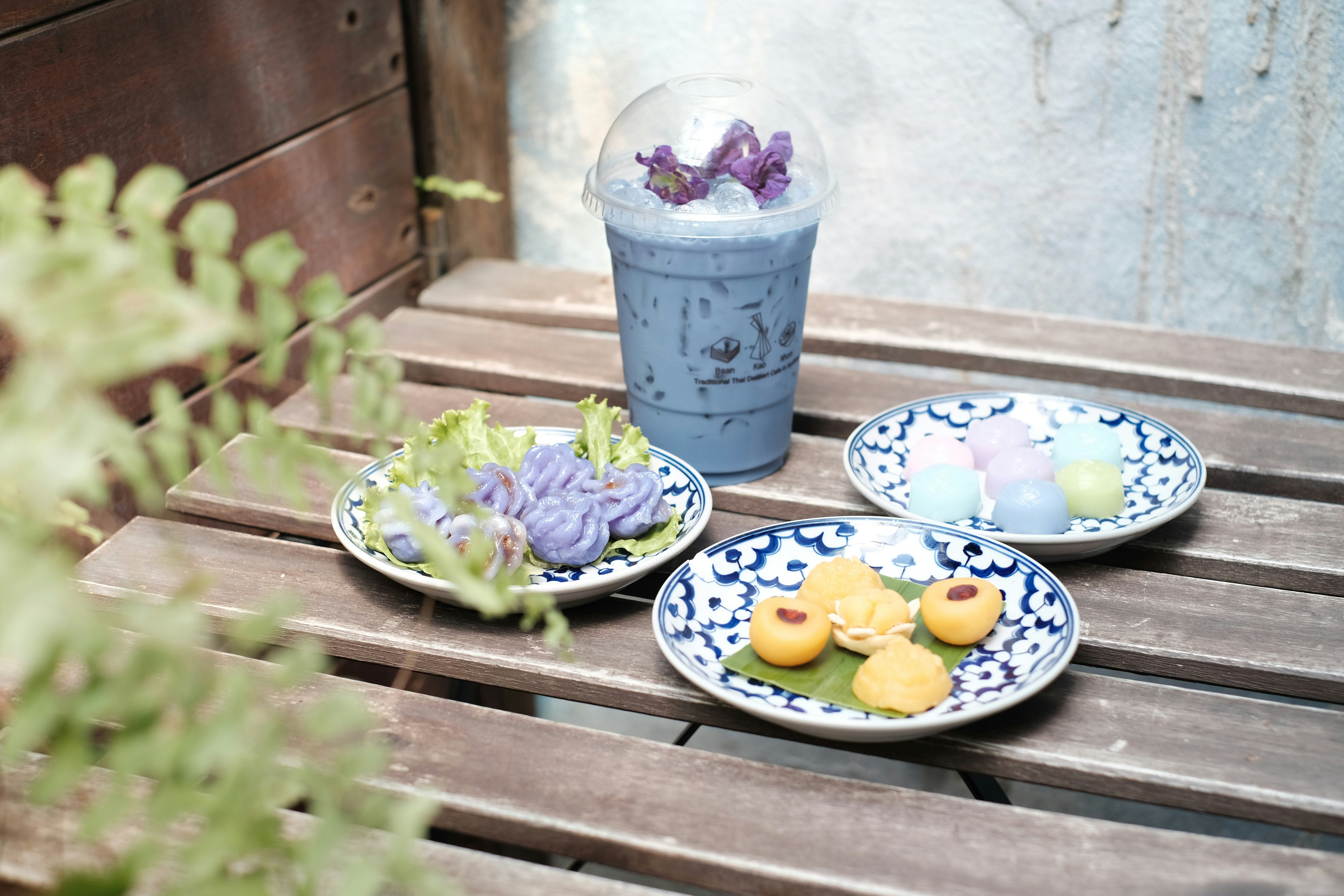 three white-and-blue ceramic plates