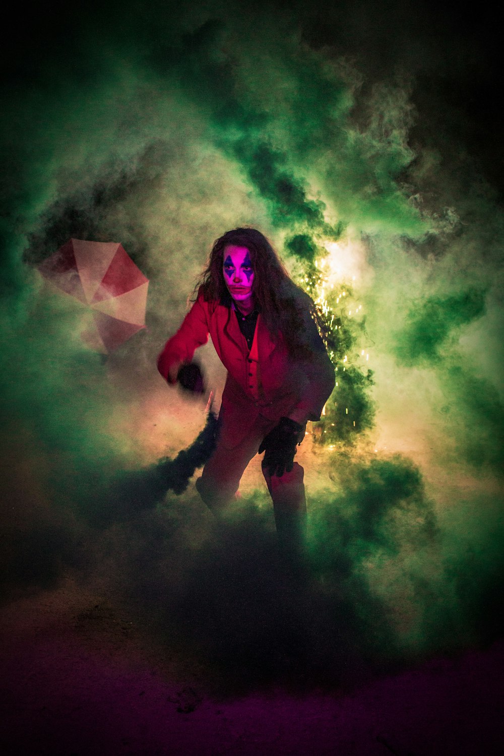 a woman in a red suit with a red umbrella