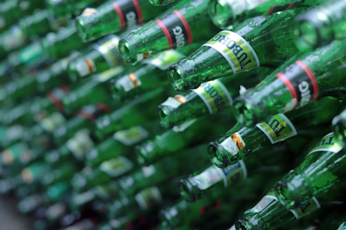 Various glass juice and milk bottles lined up with vibrant labels.