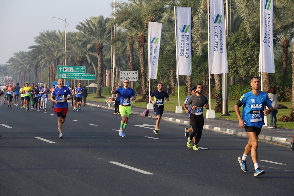 people running on road in event during daytime