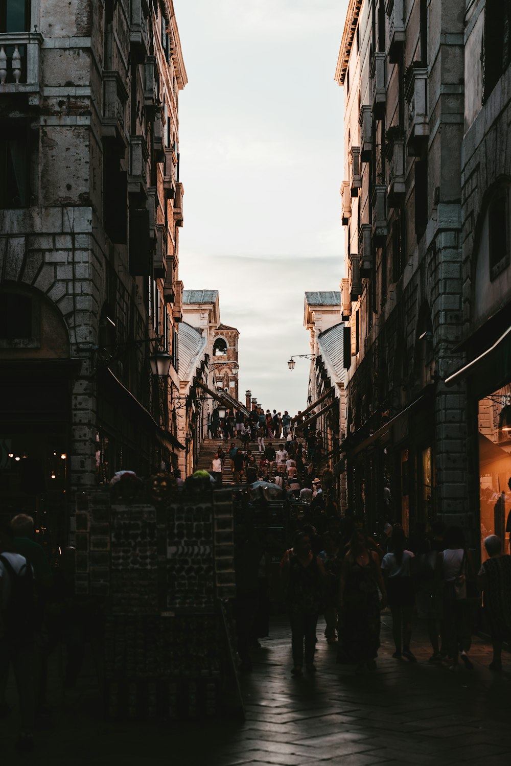 people walking between buildings