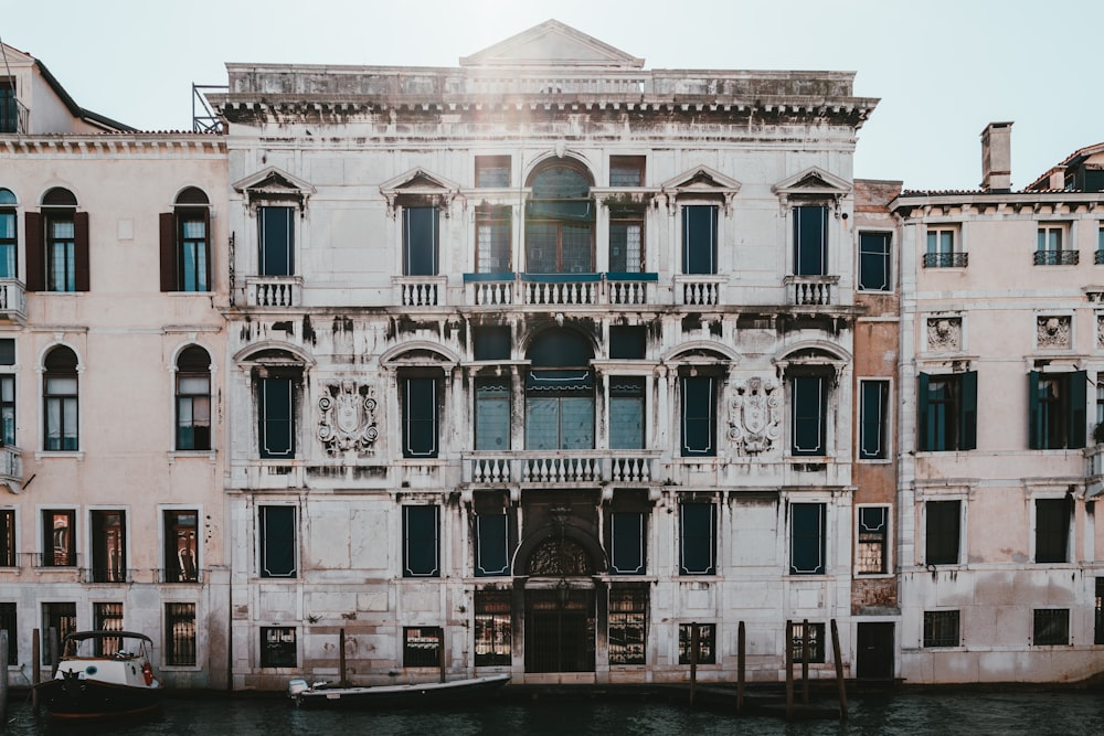 a boat is parked in front of an old building