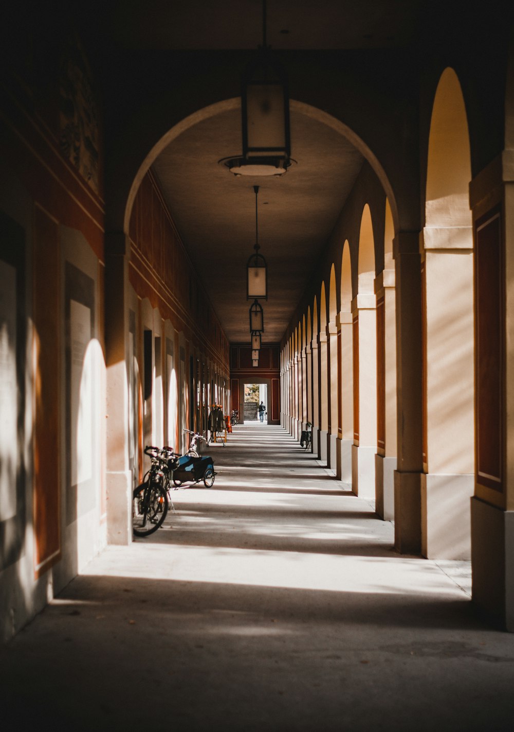 a row of motorcycles parked on the side of a building