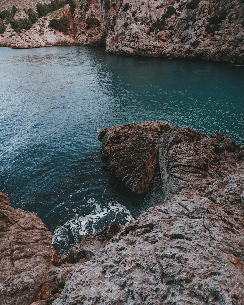 a large body of water surrounded by rocks