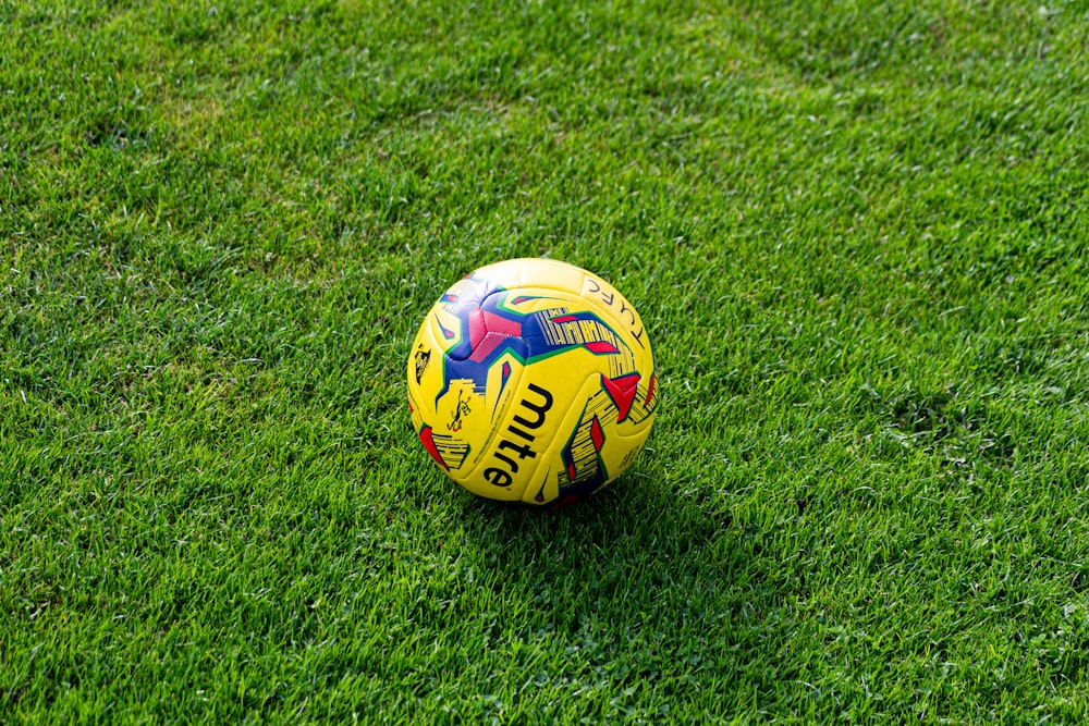 yellow and blue soccer ball close-up photography