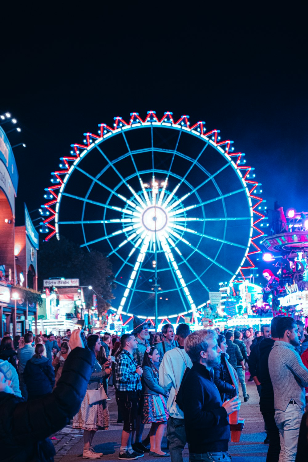 crowd of people in amusement park during night time