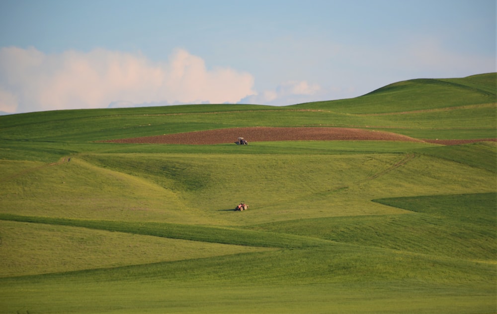 green mountain under blue and white sky at daytime