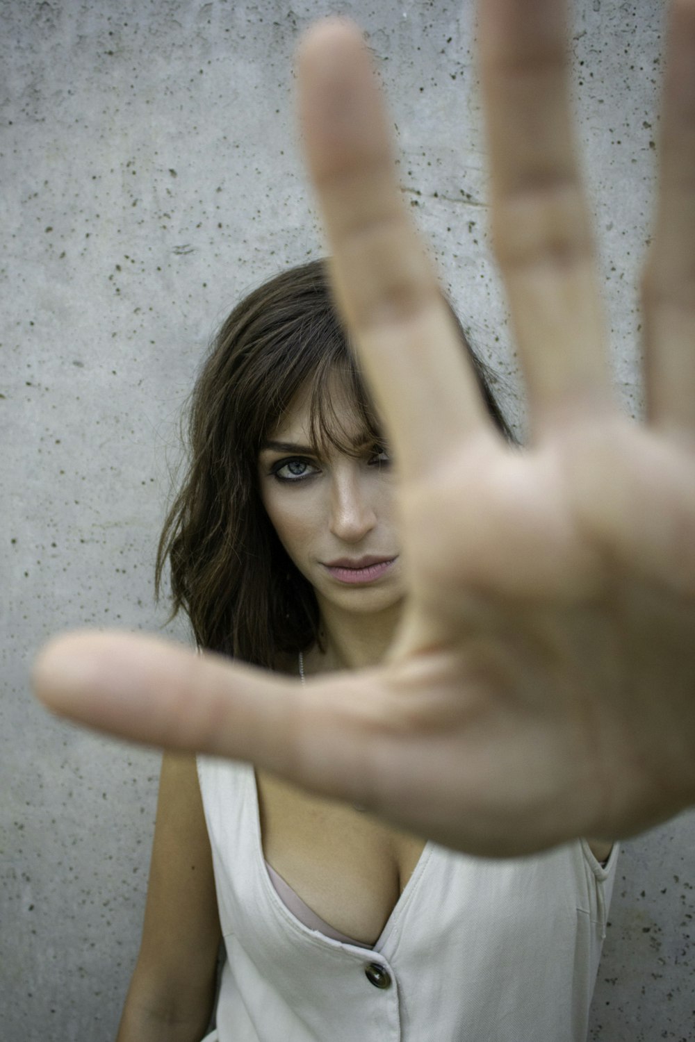 glaring woman reaching her hand