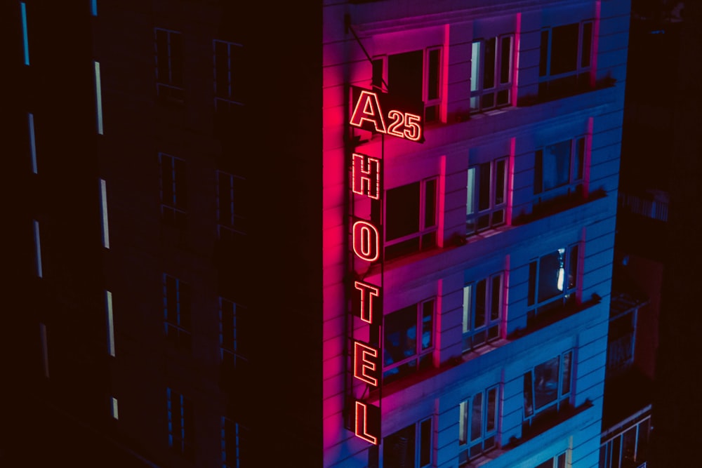 turned on A25 Hotel neon signage beside building during night