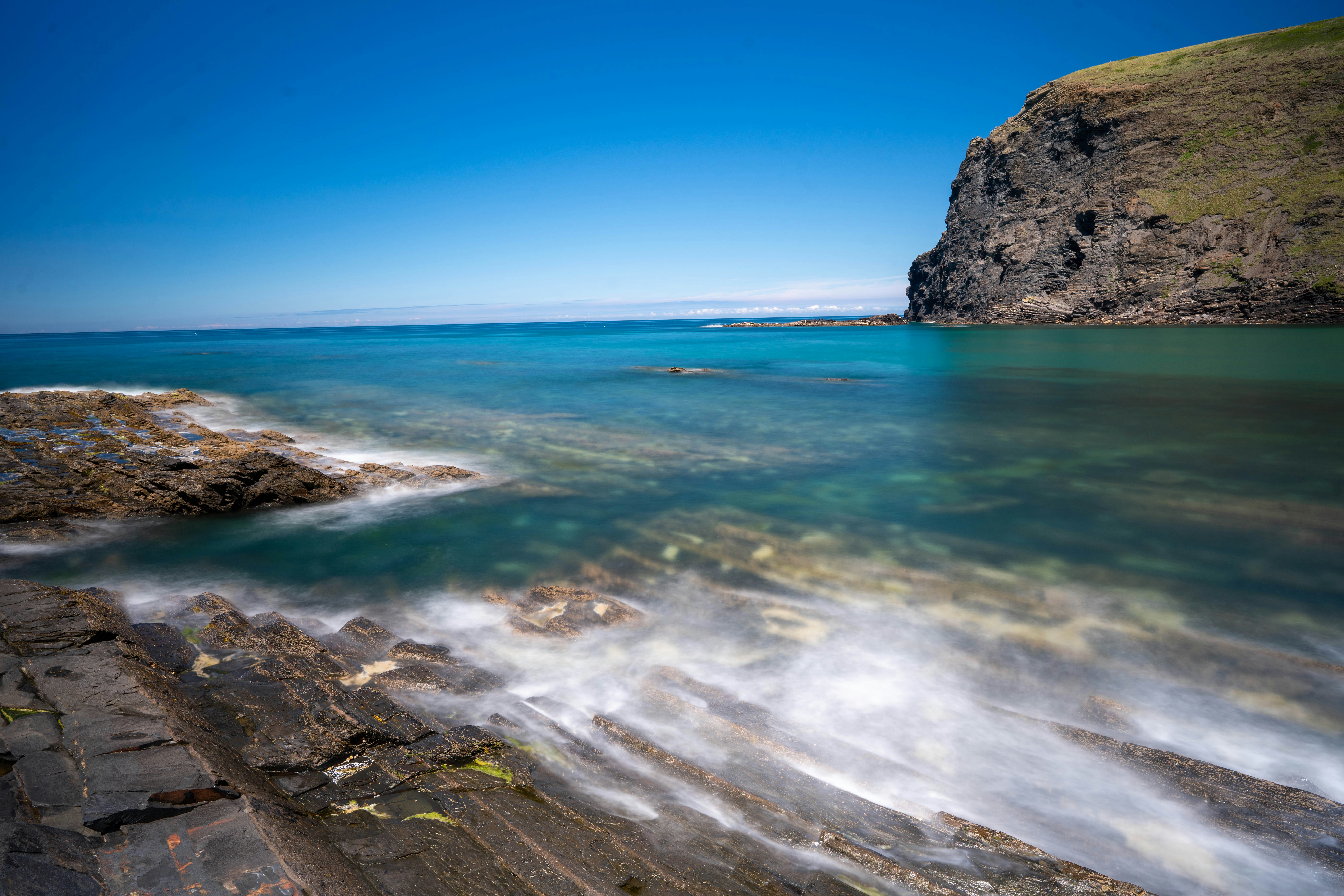 body of water under clear blue sky during daytime