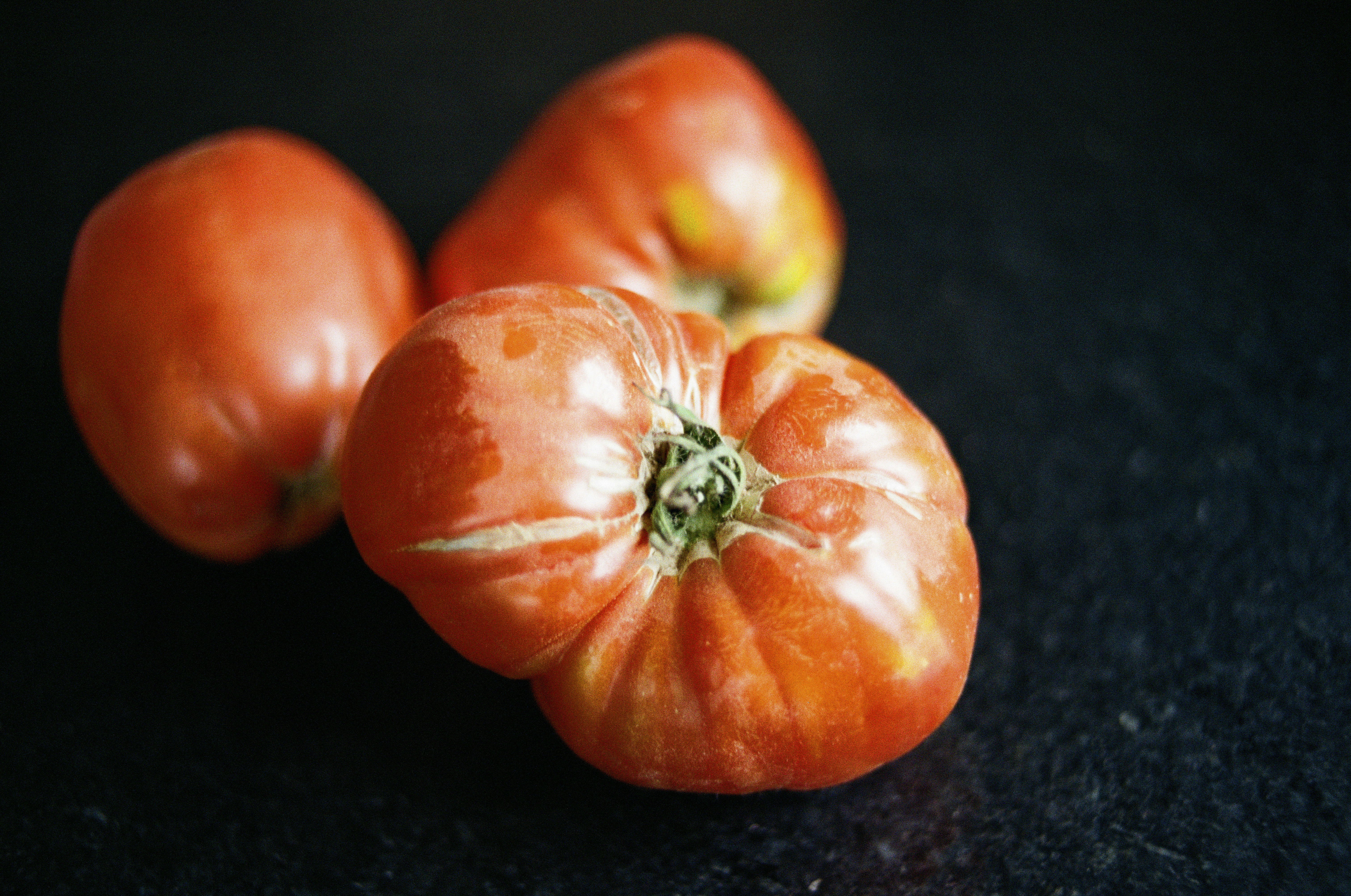 three red tomatoes