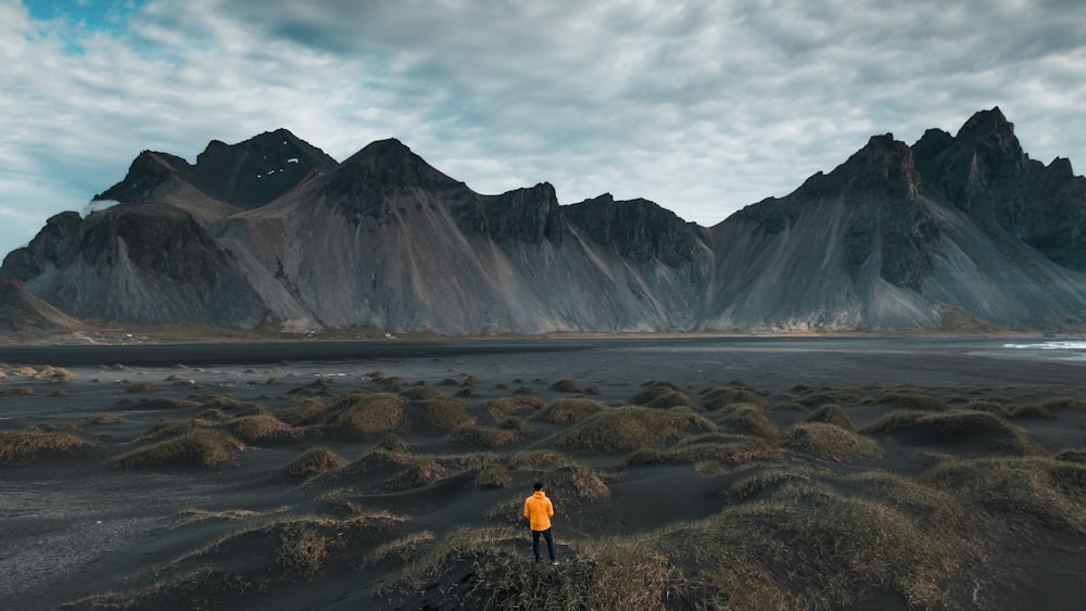 man standing on hill