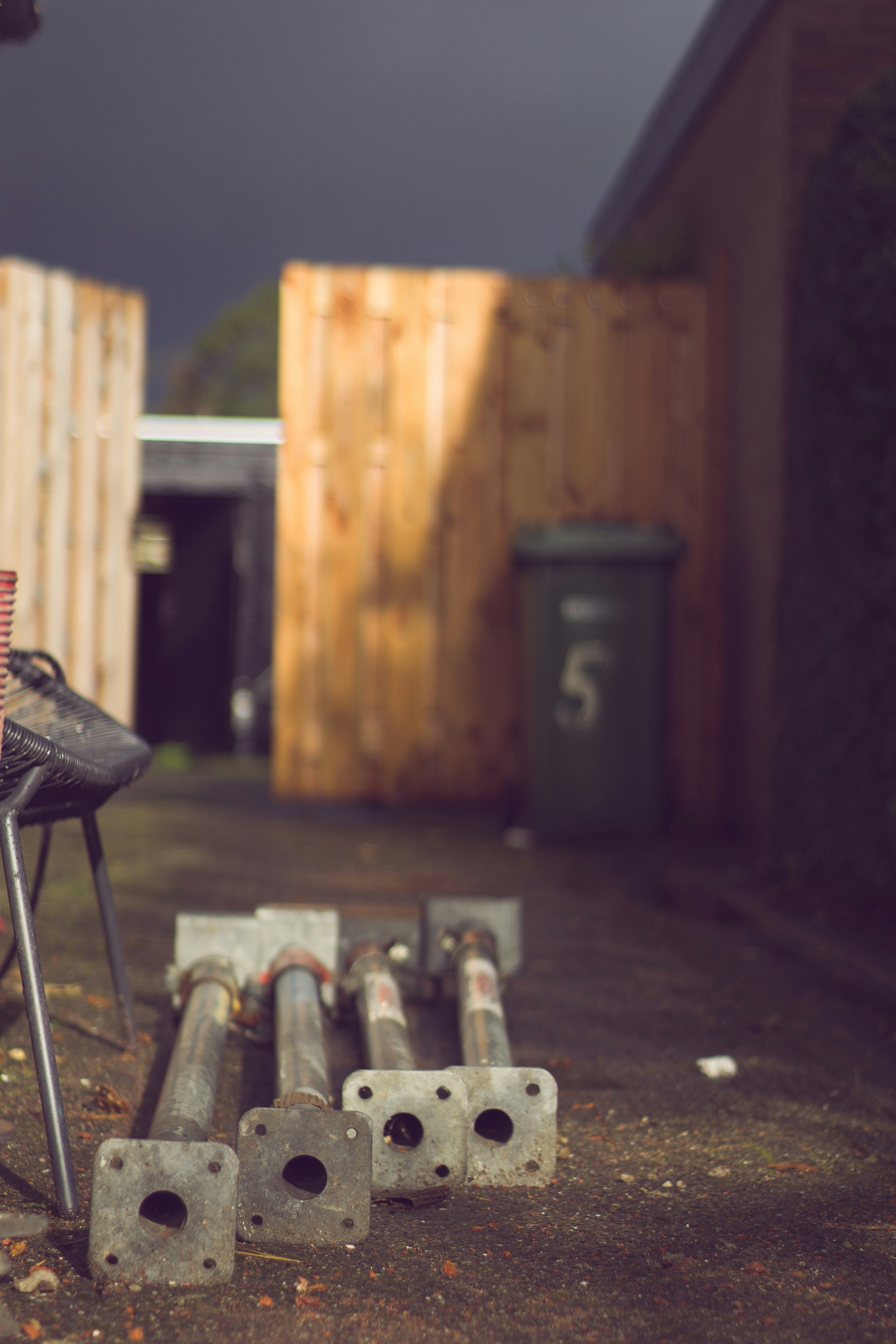 four gray stainless steel rods on ground