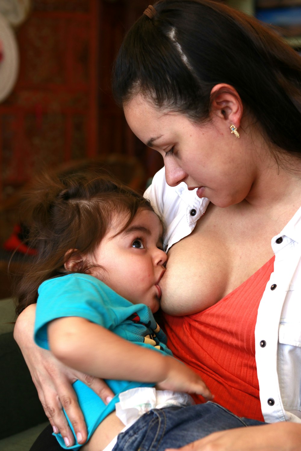 woman breastfeed the baby