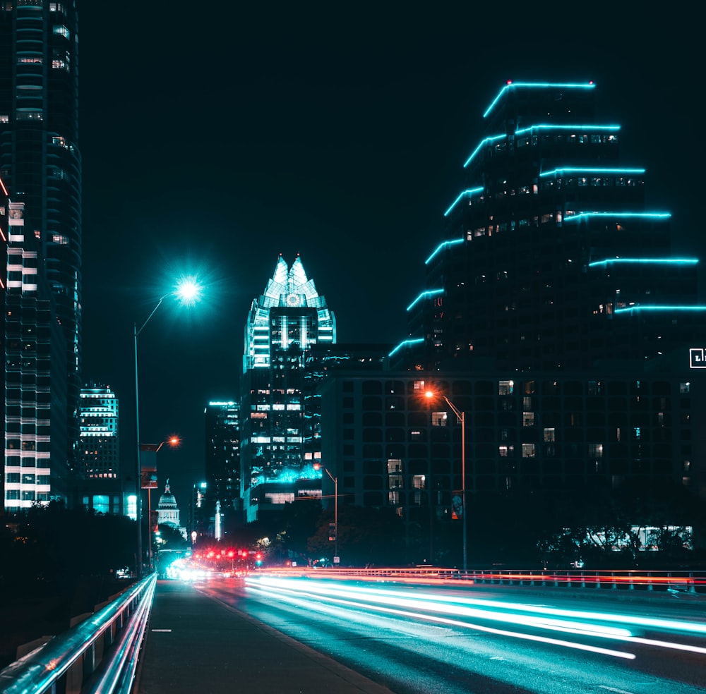 lighted street and high-rise buildings