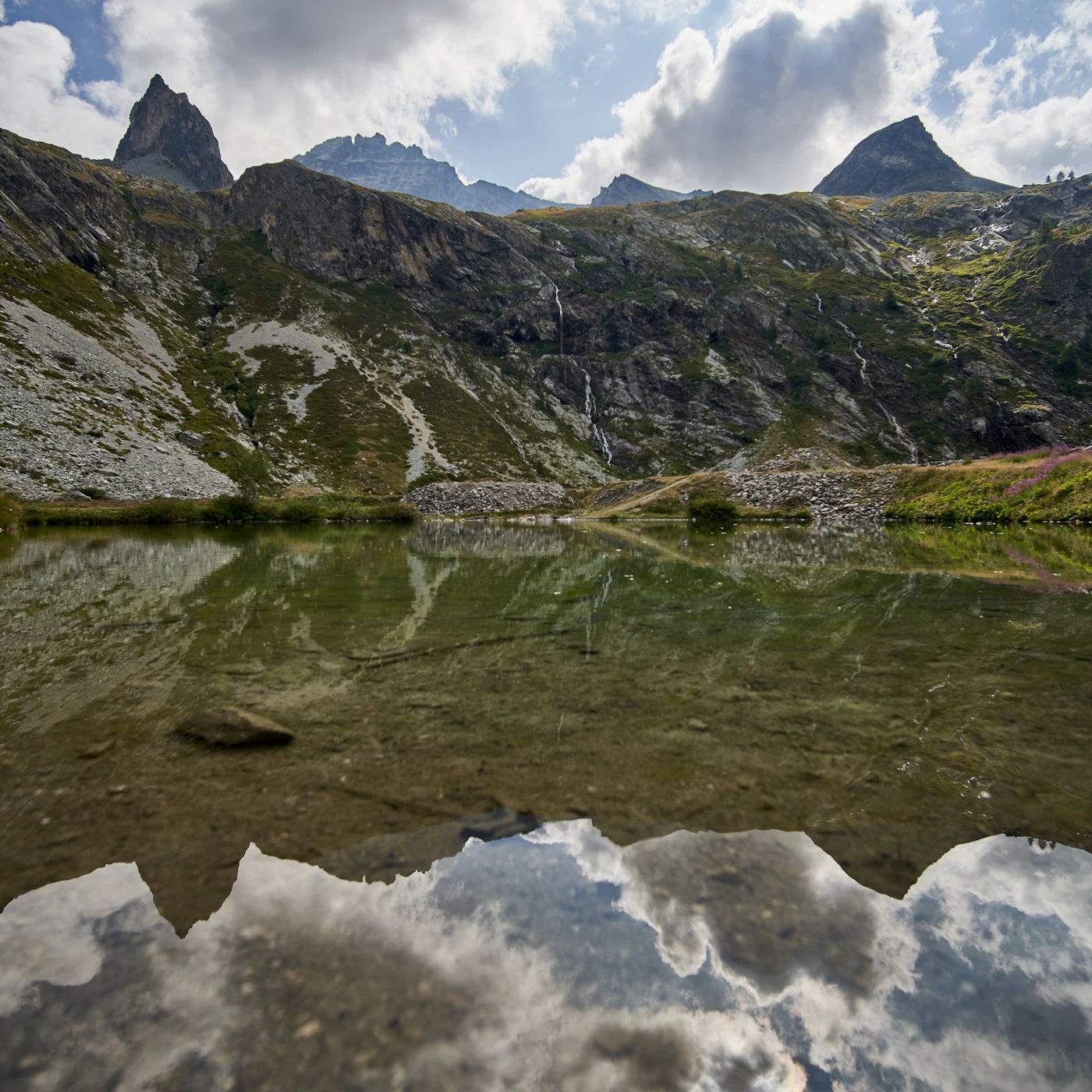 Small seaplane travelling across a mountain lake