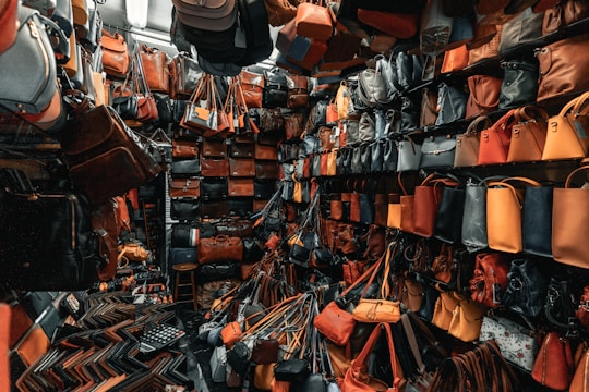 a room filled with lots of purses and handbags