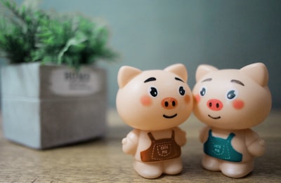 two beige pigs action figures lovely zoom background