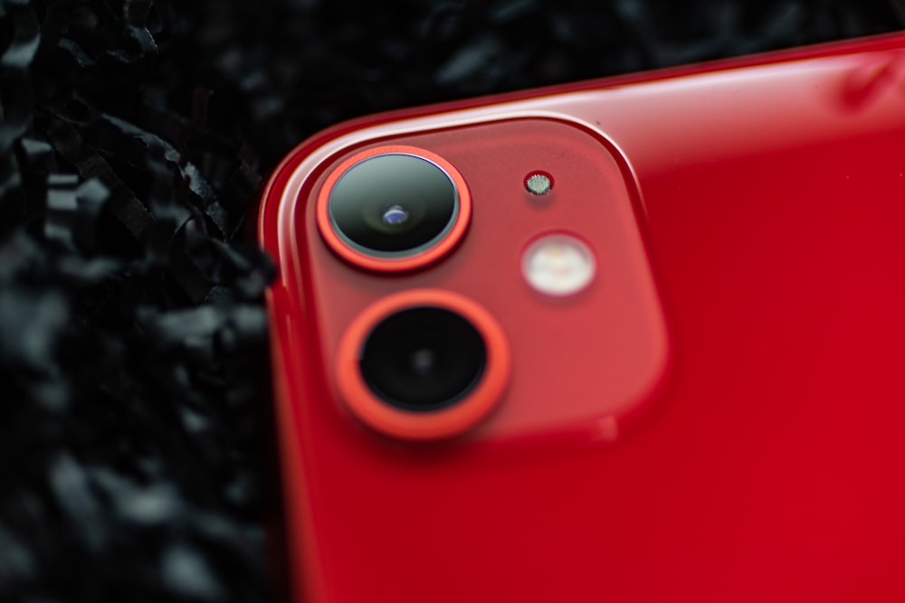 close-up photography of red iPhone 11