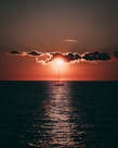 sailboat in sea during golden hour