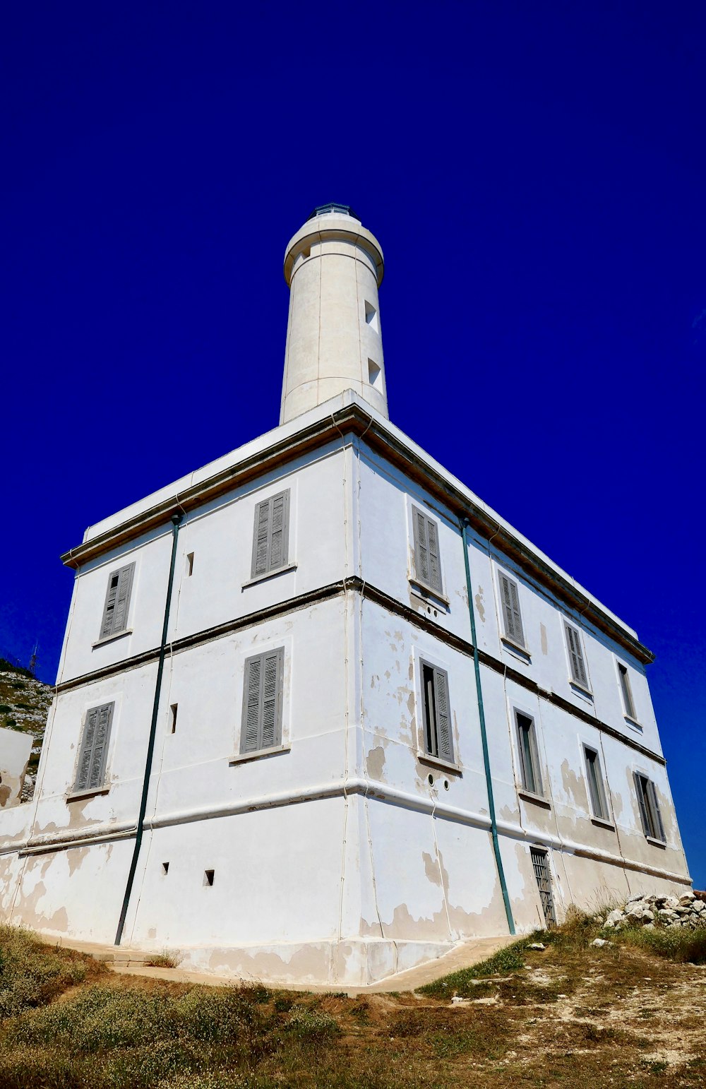white building with lighthouse during day