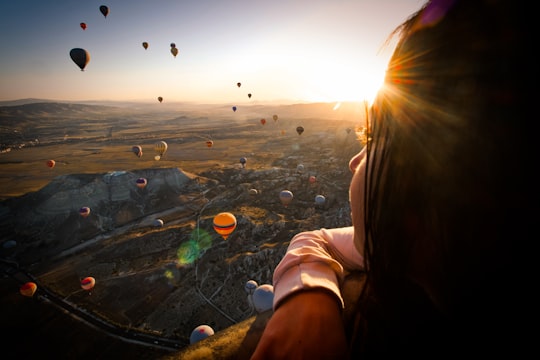 hot air balloons above woman in Cappadocia Turkey Turkey