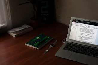 turn on MacBook Air near books