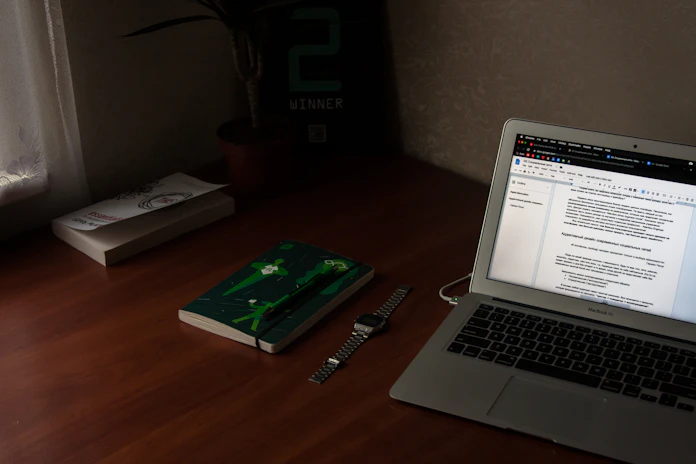 turn on MacBook Air near books