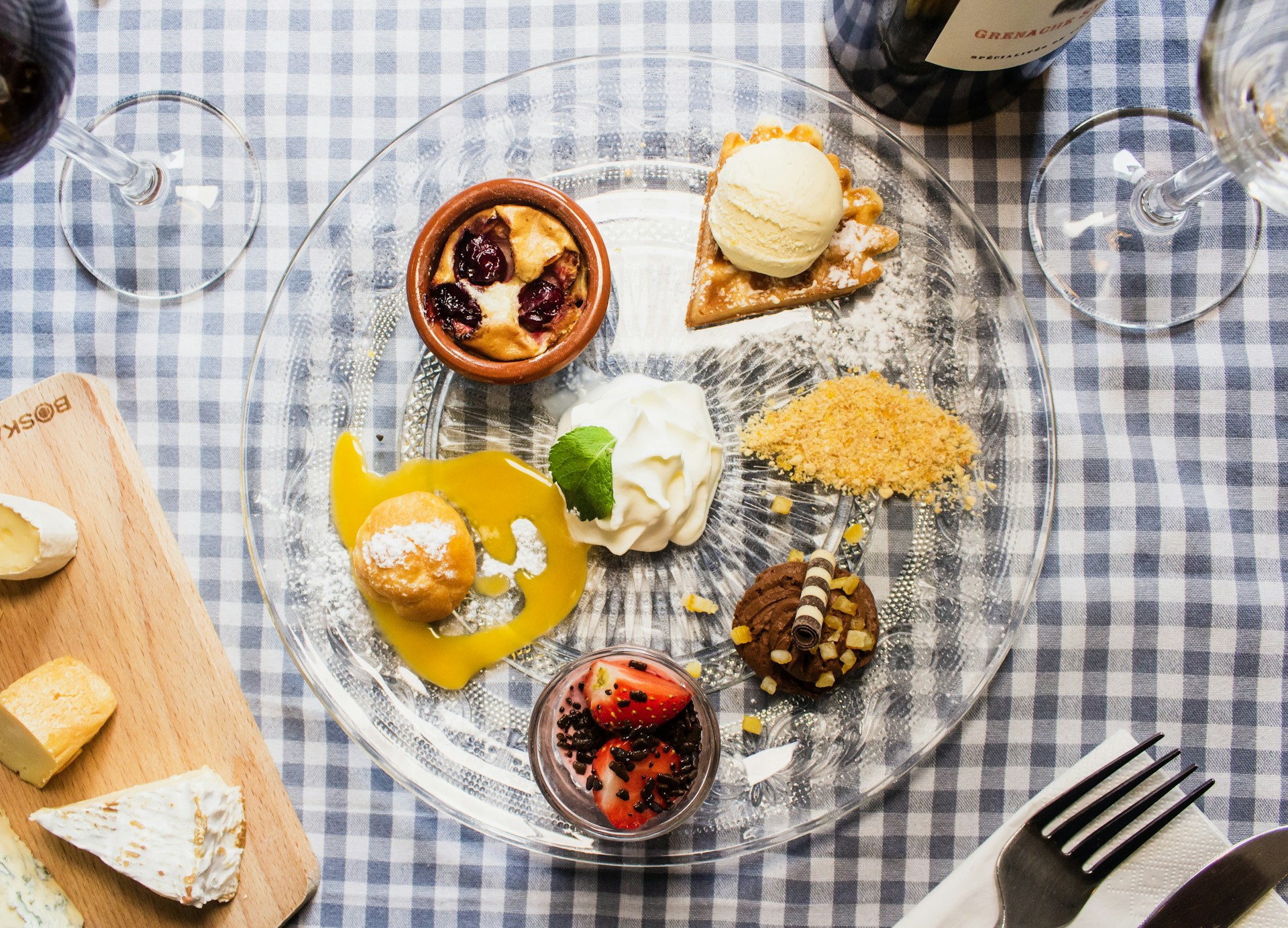 An inviting dessert platter featuring various homemade sweets, such as brownies and cupcakes, displayed with a warm ambiance.