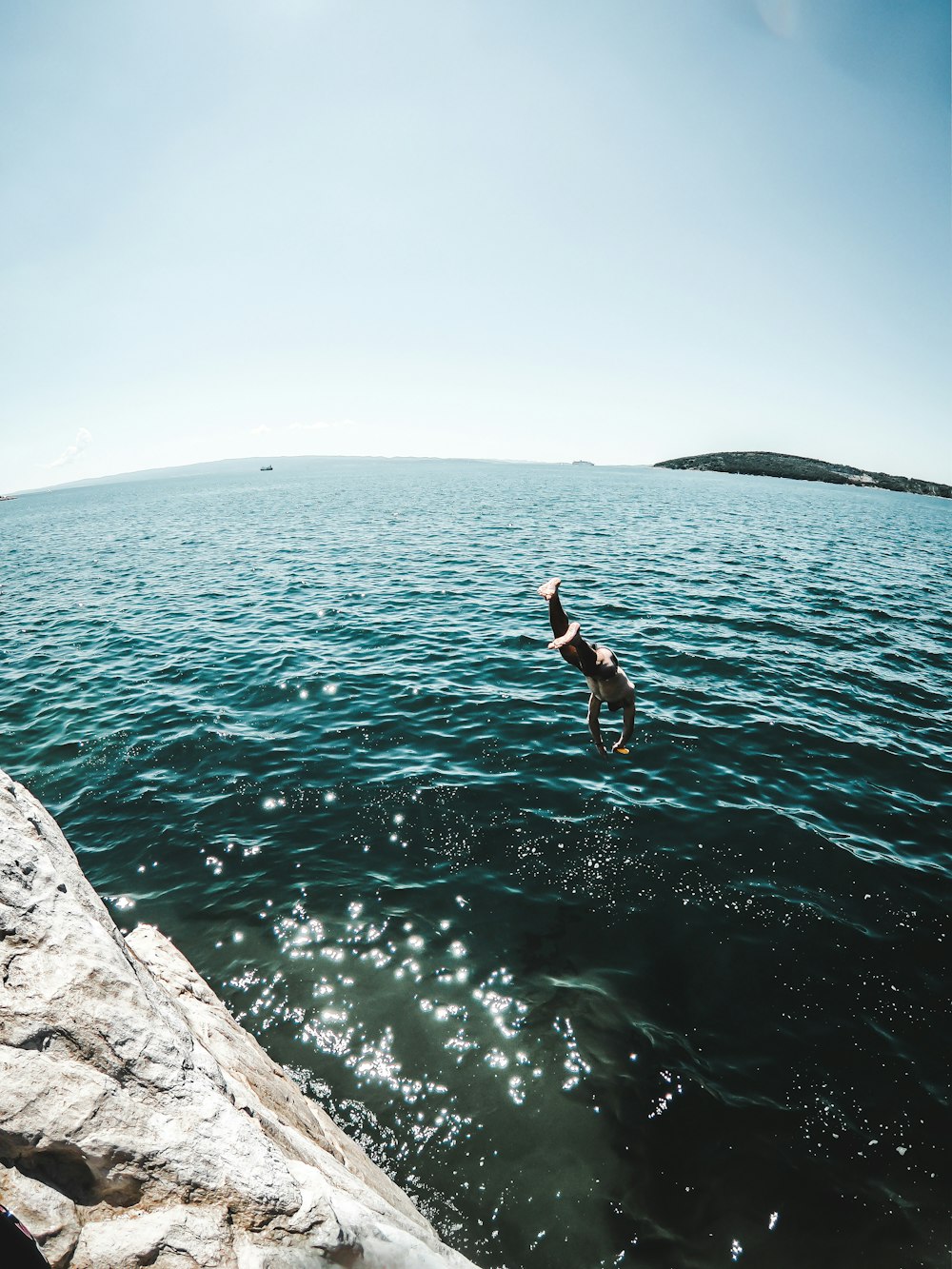 man jumping off the cliff