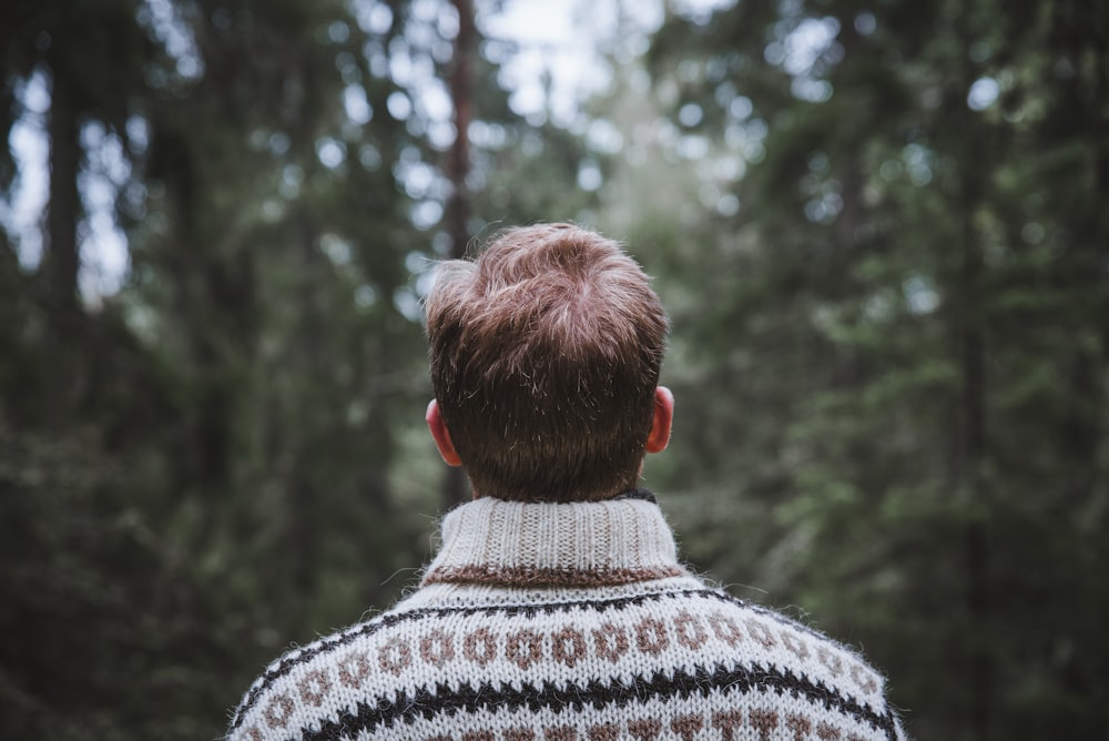 man wears white and brown sweater