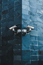 gray IP camera on black wall