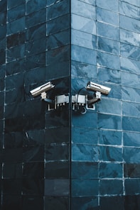 gray IP camera on black wall