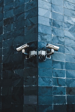 gray IP camera on black wall