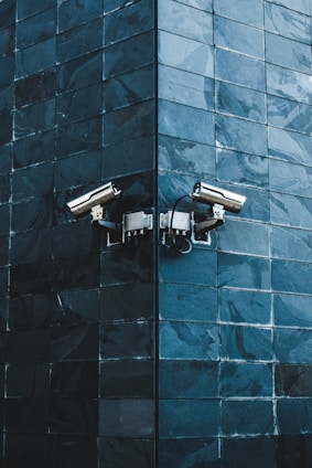 gray IP camera on black wall