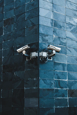 gray IP camera on black wall