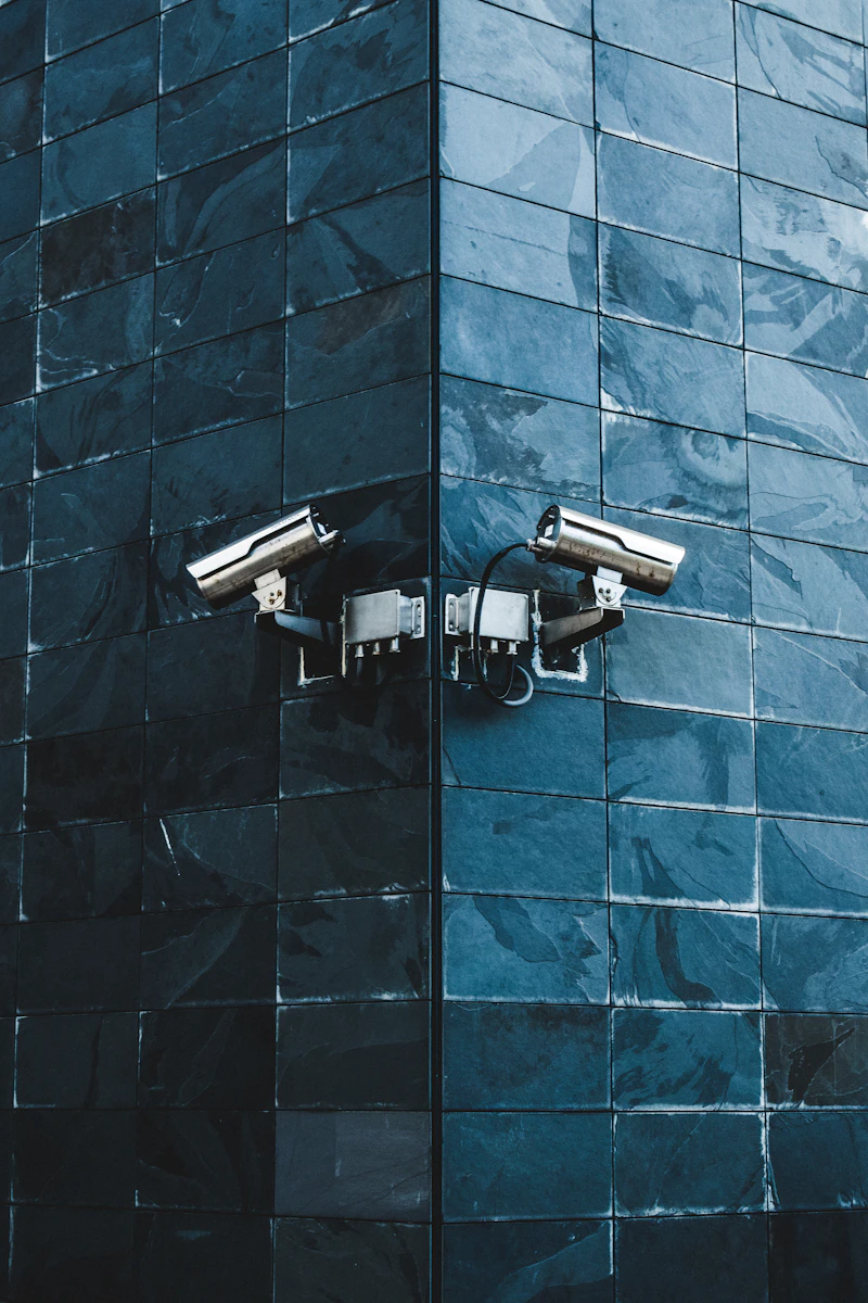 Security cameras mounted on a modern building facade