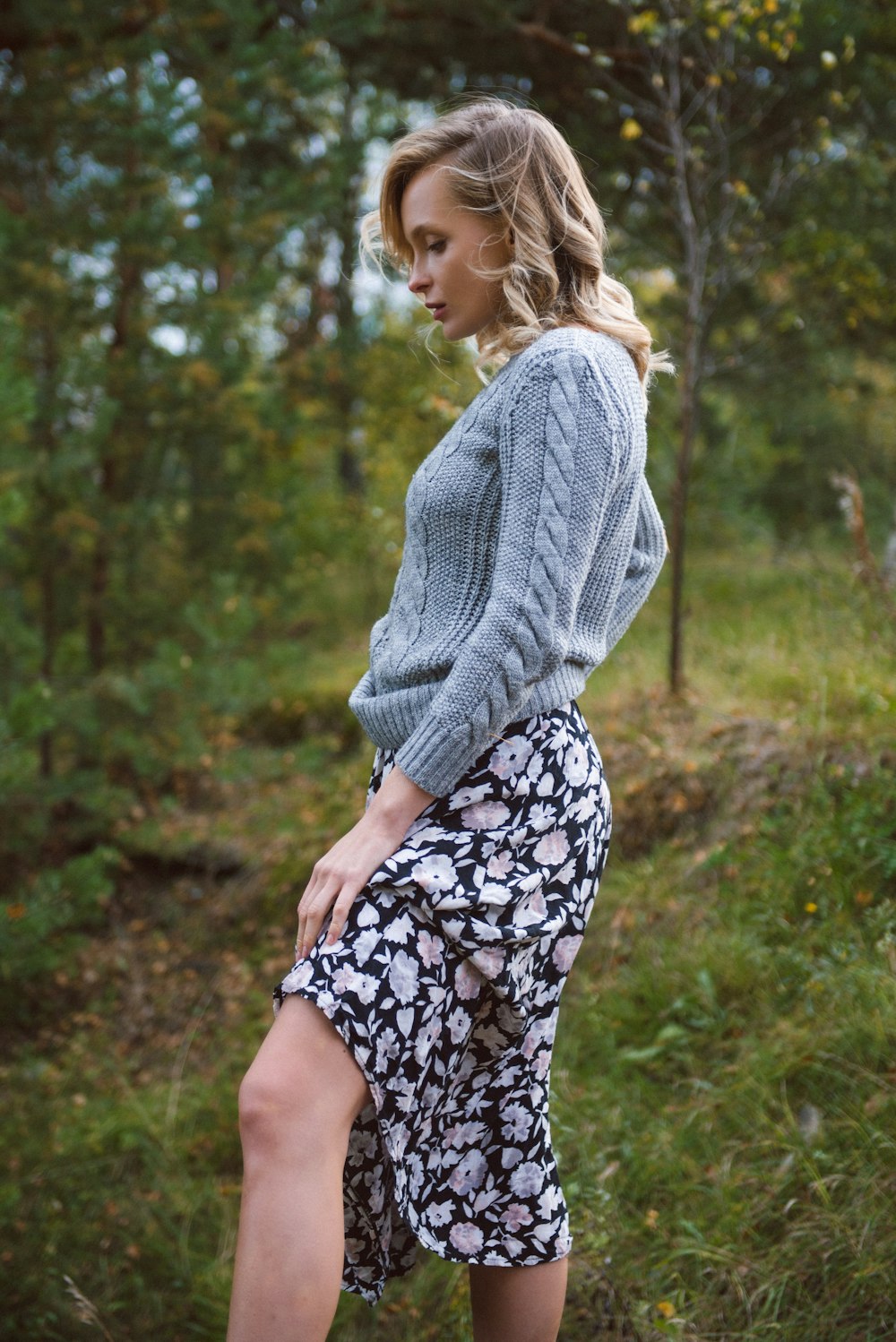 woman wears blue knit sweater