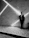 man leaning on wall