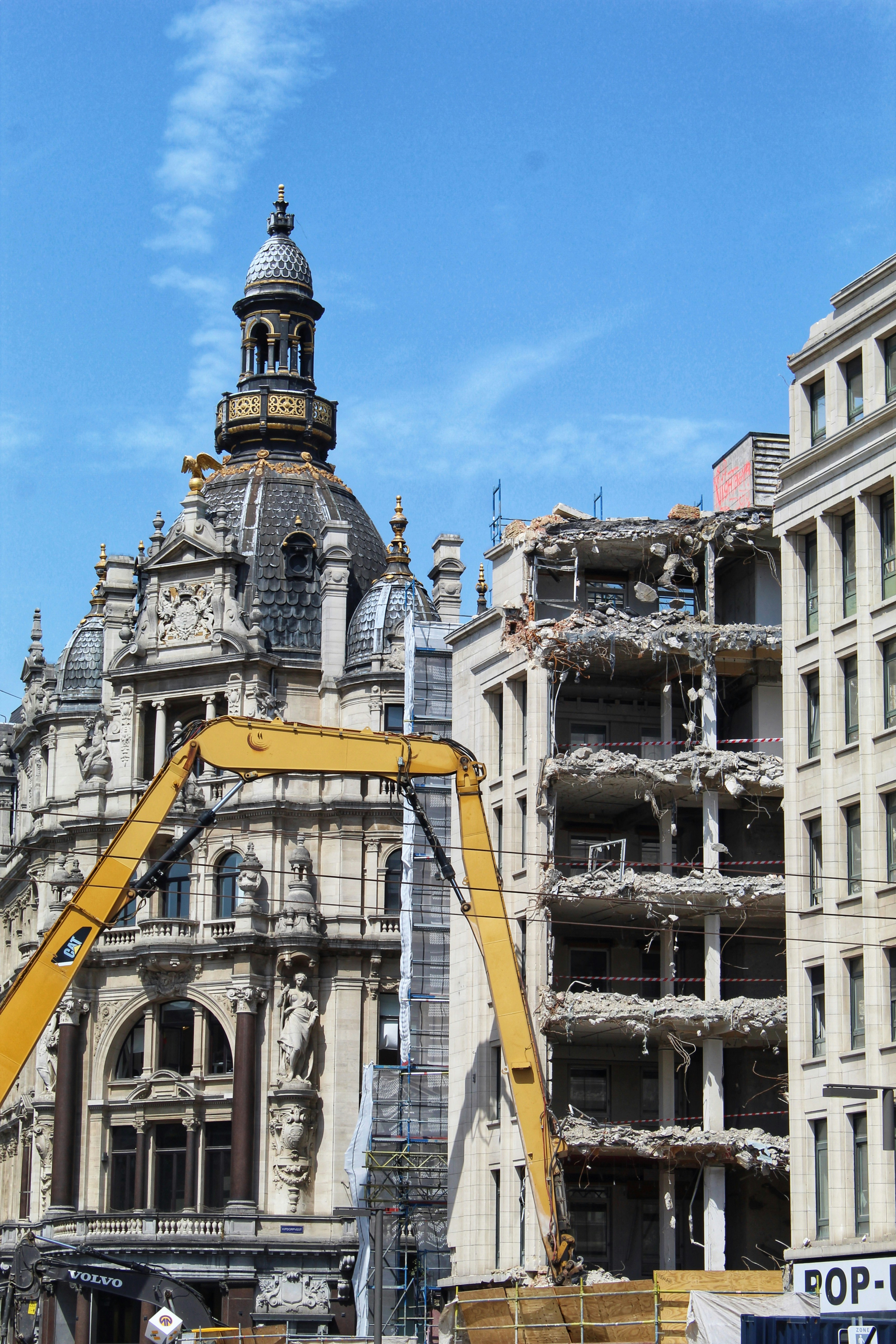 white and gray historic building under blue and white sky during daytime