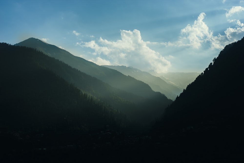 green mountains and white clouds