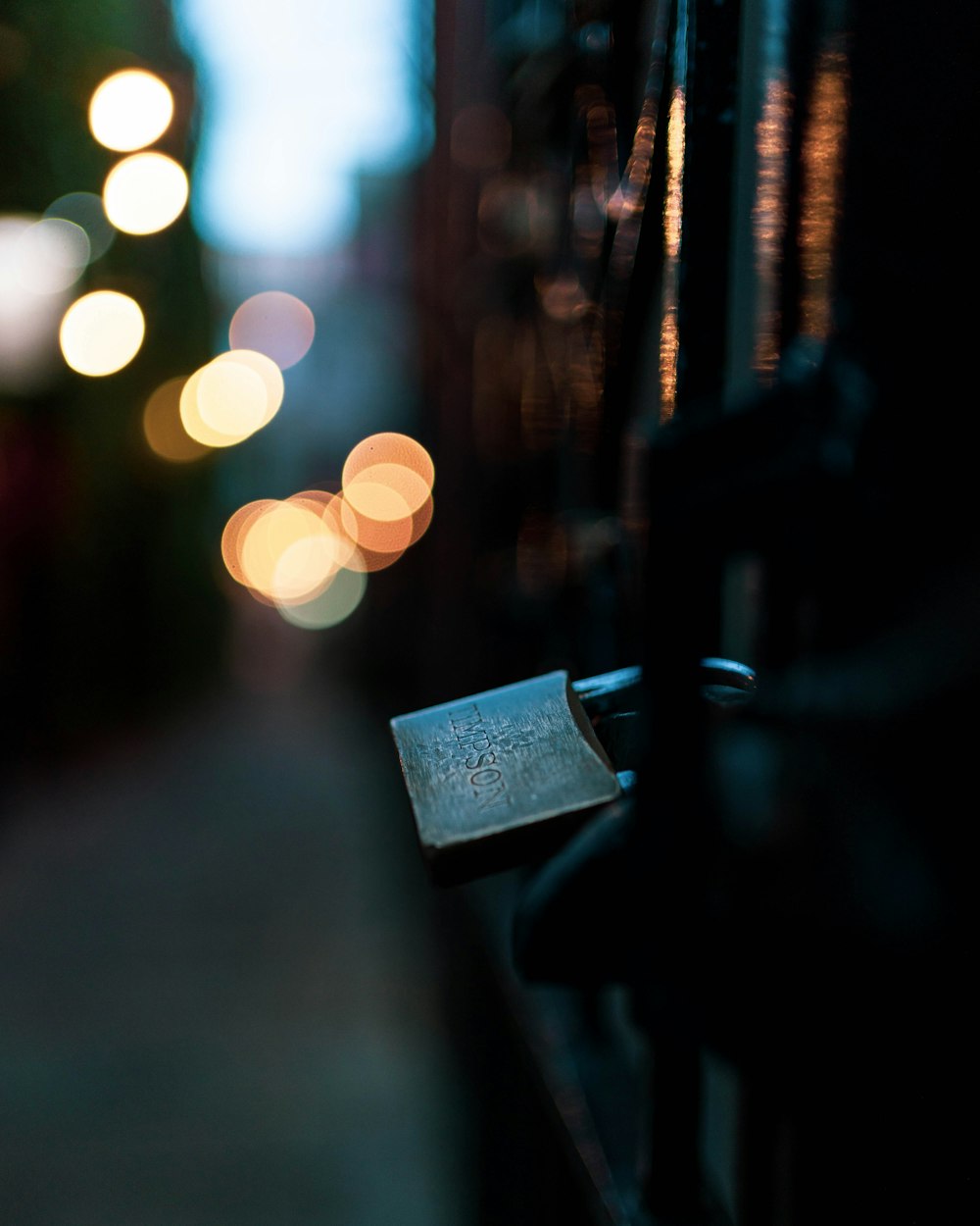 selective focus photography of padlock on fence